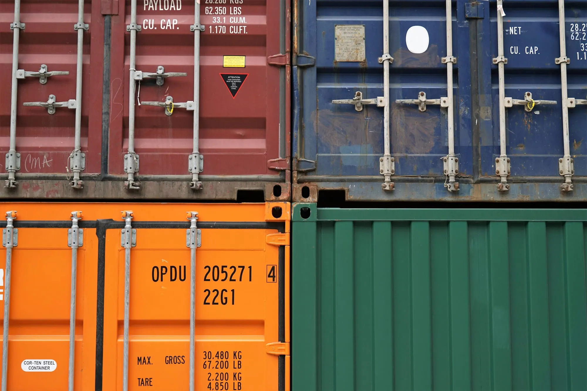 Stacked shipping cargo containers at a freight terminal