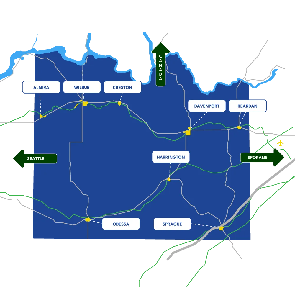 Map of Lincoln County, Washington showing Almira, Wilbur, Creston, Davenport, Reardan, Harrington, Odessa, and Sprague, with routes toward Seattle, Spokane, and Canada